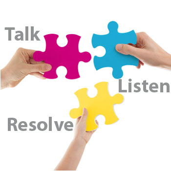Three hands holding pink, yellow & blue puzzle pieces with text "talk, listen, resolve.
